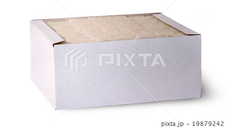 In front white sugar cubes in a box In front white sugar cubes in a box 19879242