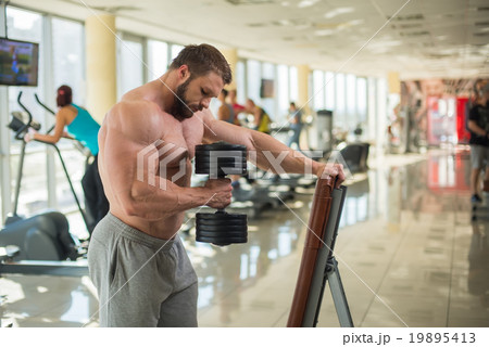 Brutal man in gym. Brutal man in gym. 19895413