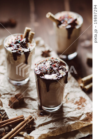 Latte with whipped cream and chocolate Latte with whipped cream and chocolate 19897294