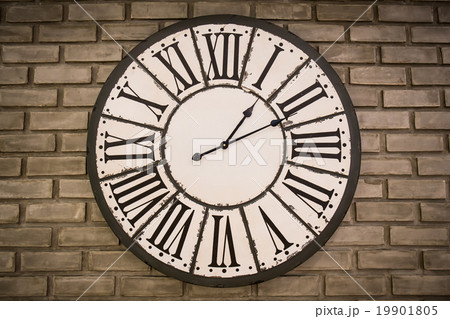 vintage clock on brick wall 19901805