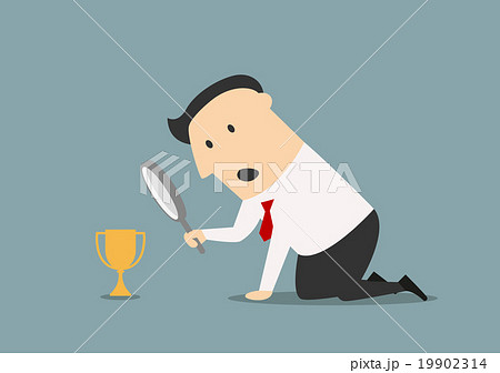 Businessman looking at trophy through magnifier Businessman looking at trophy through magnifier 19902314