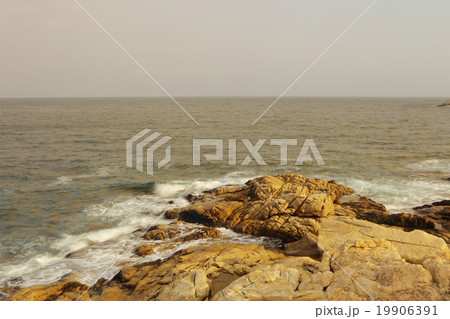 rocky sea coast and blurred water in shek o, 19906391