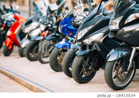 Motorbike, motorcycle scooters parked in row in 19913034