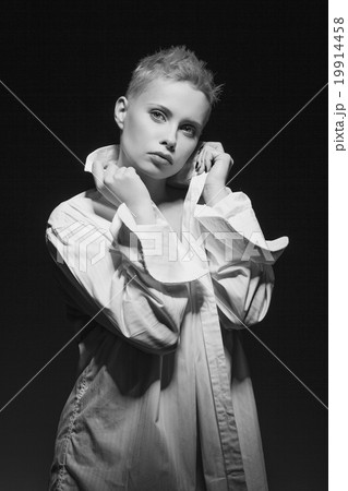 Beautiful young woman in white men shirt 19914458
