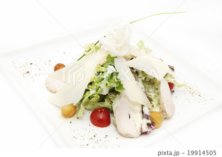 caesar salad on a white plate in a restaurant caesar salad on a white plate in a restaurant 19914505