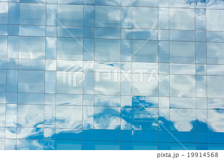 blue sky and clouds reflected in office building 19914568