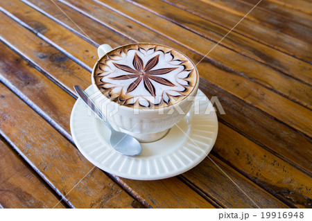Latte Coffee art on the wooden desk. 19916948