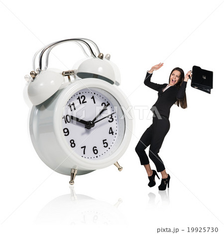 Business woman stand near big alarm clock 19925730