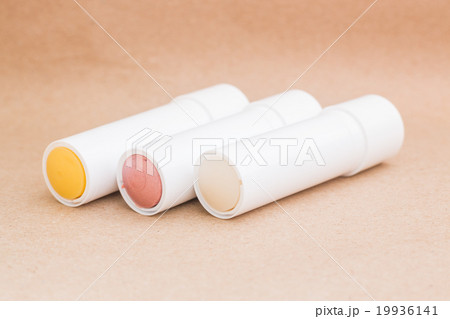 Moisturizer lipstick on brown natural background Moisturizer lipstick on brown natural background 19936141