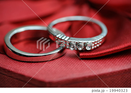two wedding rings on a red background two wedding rings on a red background 19940323