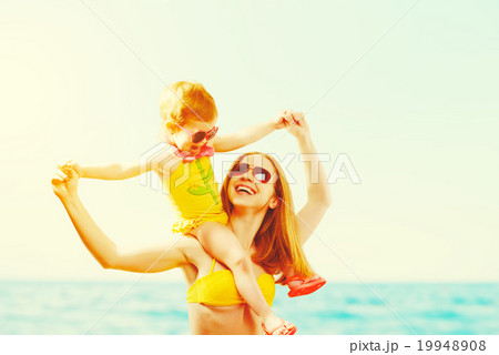 happy family on the beach. mother and child daughter 19948908