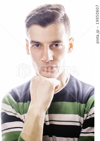 Portrait of a smart serious young man standing 19950607