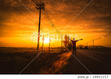 Silhouette Man on the road with relax at sunset. Silhouette Man on the road with relax at sunset. 19952157