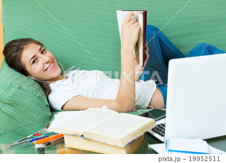 Teenager girl doing homework Teenager girl doing homework 19952511