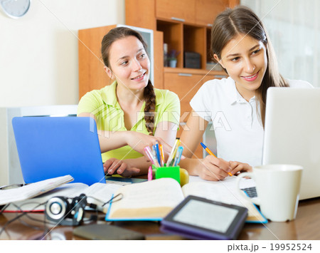Student girls studying at home 19952524