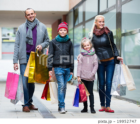 Parents with children shopping in city. Parents with children shopping in city. 19952747