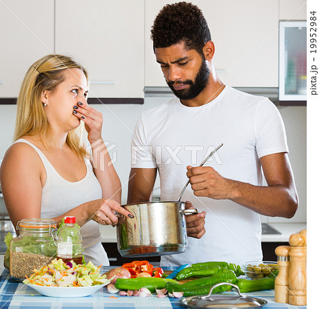 Interracial couple with stinking food. 19952984