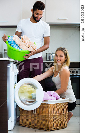 man and girl near washing machine 19953002