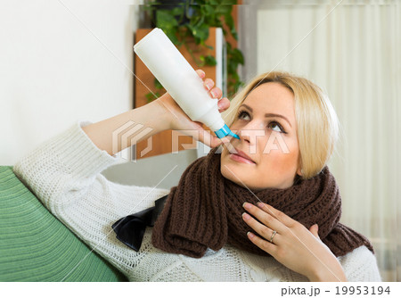 Young blonde with nasal spray 19953194