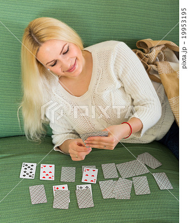 Woman with cards in home interior 19953195