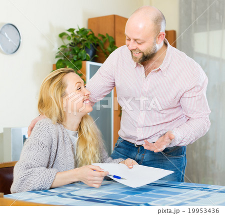 Couple with documents indoor 19953436