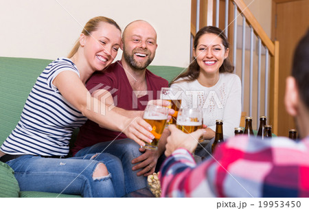 Adults drinking beer indoor 19953450