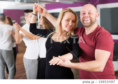Couples enjoying of partner dance Couples enjoying of partner dance 19953497