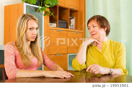 Two women sharing bad news 19953901