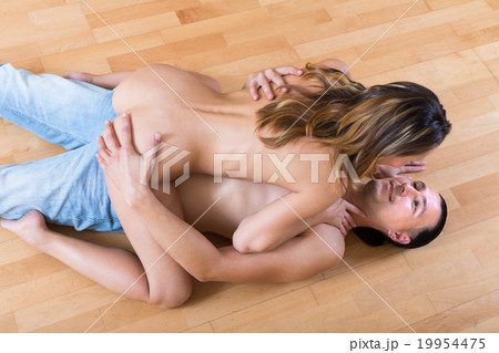 Woman and man making love indoor 19954475