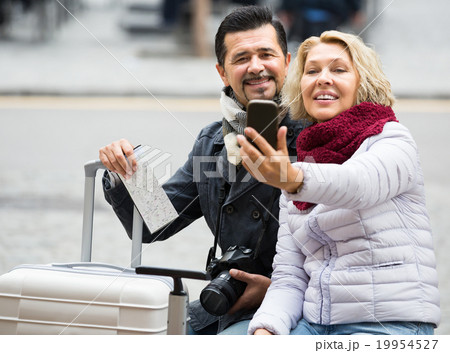 Elderly tourists taking selfie 19954527