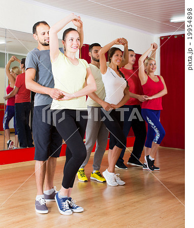 Group of people dancing salsa in studio Group of people dancing salsa in studio 19954898
