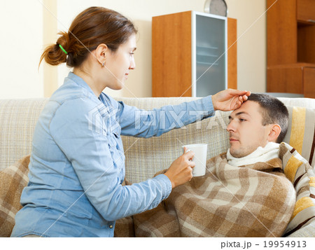 woman caring for sick husband 19954913