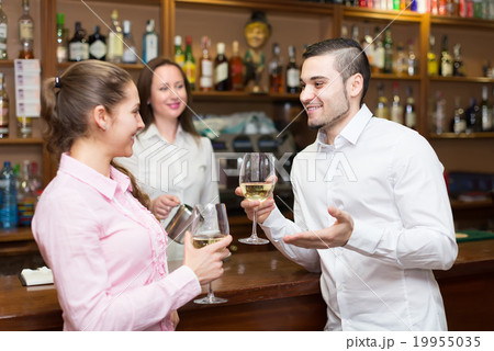barista and two clients at counter barista and two clients at counter 19955035