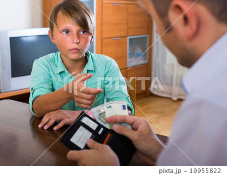 Boy asking father for money 19955822