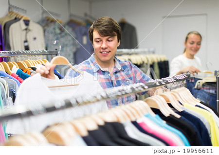 Male customer in clothing store Male customer in clothing store 19956611
