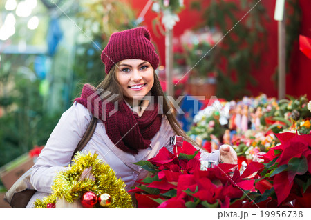 female customer choosing decorations female customer choosing decorations 19956738