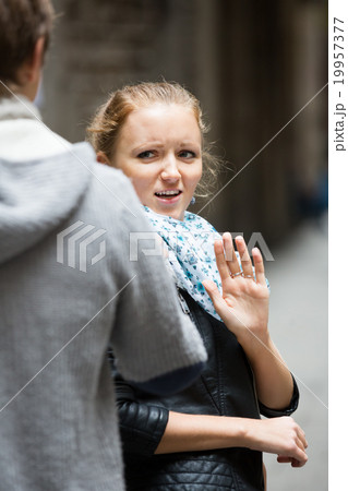 Couple having quarrel on city street Couple having quarrel on city street 19957377