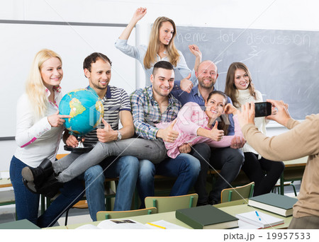 students of different age doing group selfie on smartphone students of different age doing group selfie on smartphone 19957533