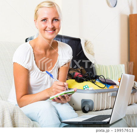 Girl with laptop and baggage. 19957613