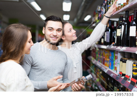 Adult customers choosing vodka 19957838