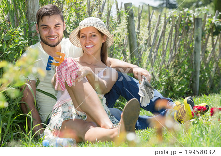 Young couple gardening together . 19958032