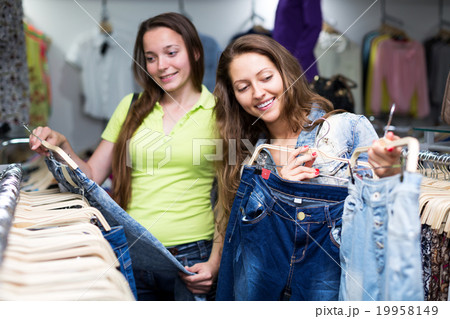 woman selecting jeans 19958149