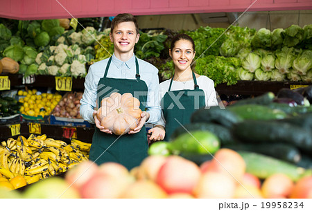 Sellers offering large squash . Sellers offering large squash . 19958234