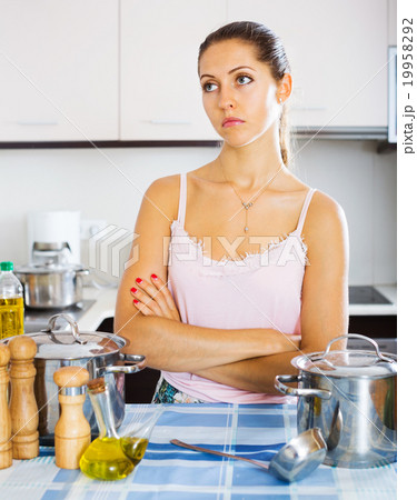 Tired woman at the kitchen Tired woman at the kitchen 19958292