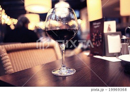 glass of wine restaurant interior serving dinner 19969368