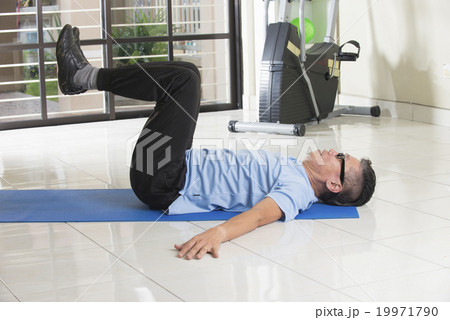 asian senior male streching at the gym asian senior male streching at the gym 19971790