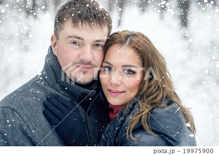Portrait of happy couple in winter park Portrait of happy couple in winter park 19975900