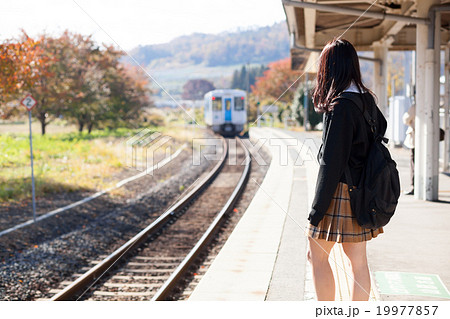 電車通学をする女子高生の写真素材