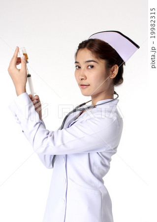 Young female nurse holding syringe 19982315