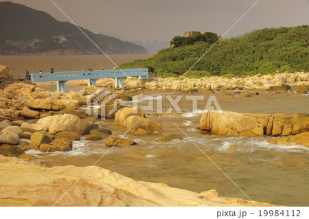 rocky sea coast and blurred water in shek o 19984112
